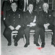 Stadtarchiv Neustadt a. Rbge., ARH Slg. Bartling 1251, Gruppenbild mit sechs verdienten Feuerwehrwehrmännern in Uniform aus Borstel, drei stehend, drei sitzend